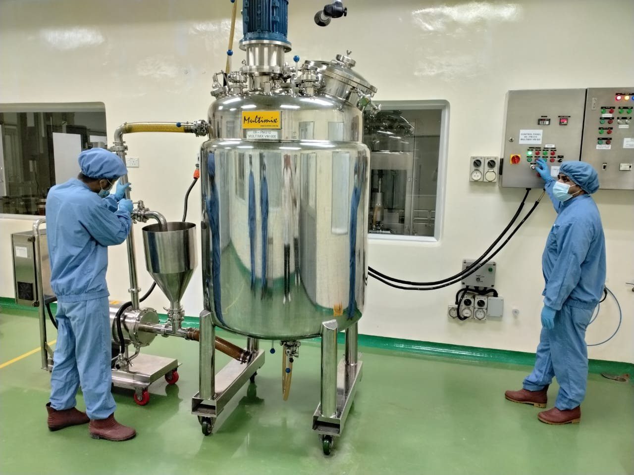 Operators at work in the Range Pharma production mixing suite